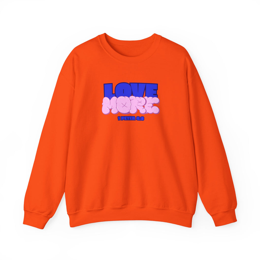 Love More sweater in orange, crewneck with blue LOVE graphic and pink plush-style shapes