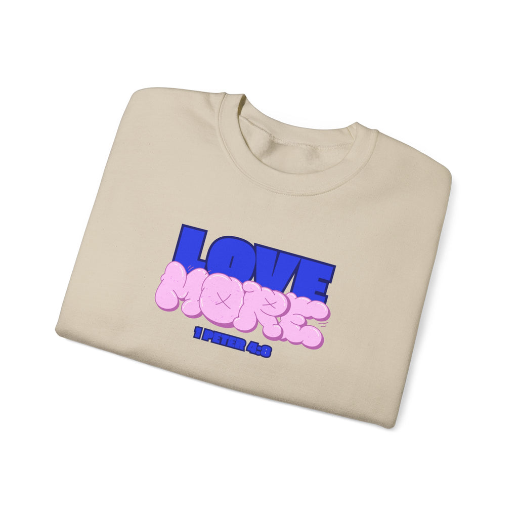 Sand crewneck sweater with long sleeves; pink LOVE graphic and small text on front