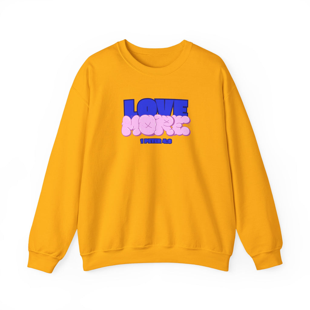 Gold crewneck sweater with long sleeves; pink LOVE graphic and text on front
