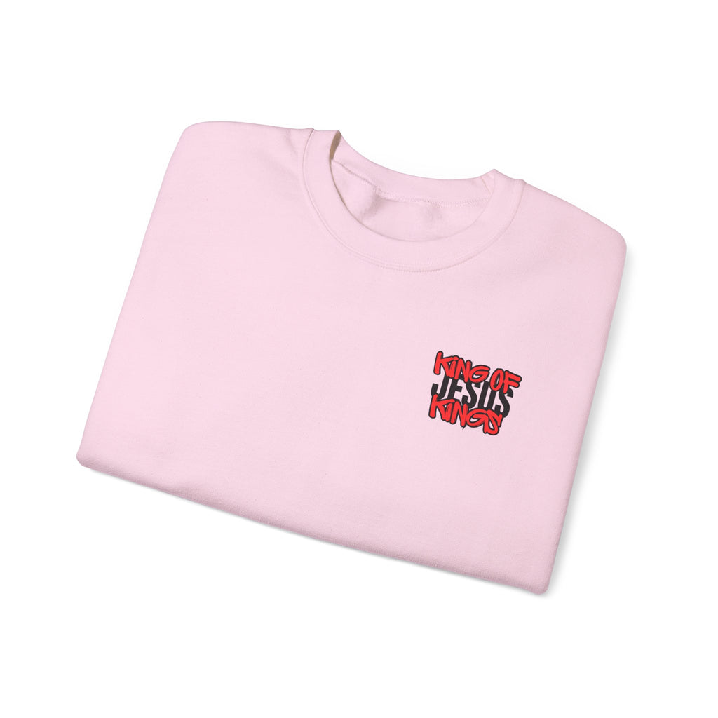Light pink sweater folded with small 'King of Kings' chest logo