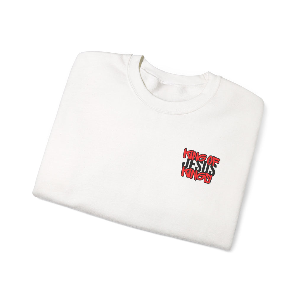 White crewneck sweater laid flat, showing small red and blue chest graphic.