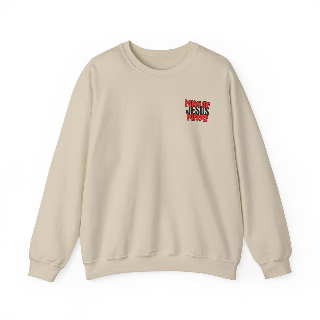 Beige crewneck sweater with small red and blue chest graphic on right side.