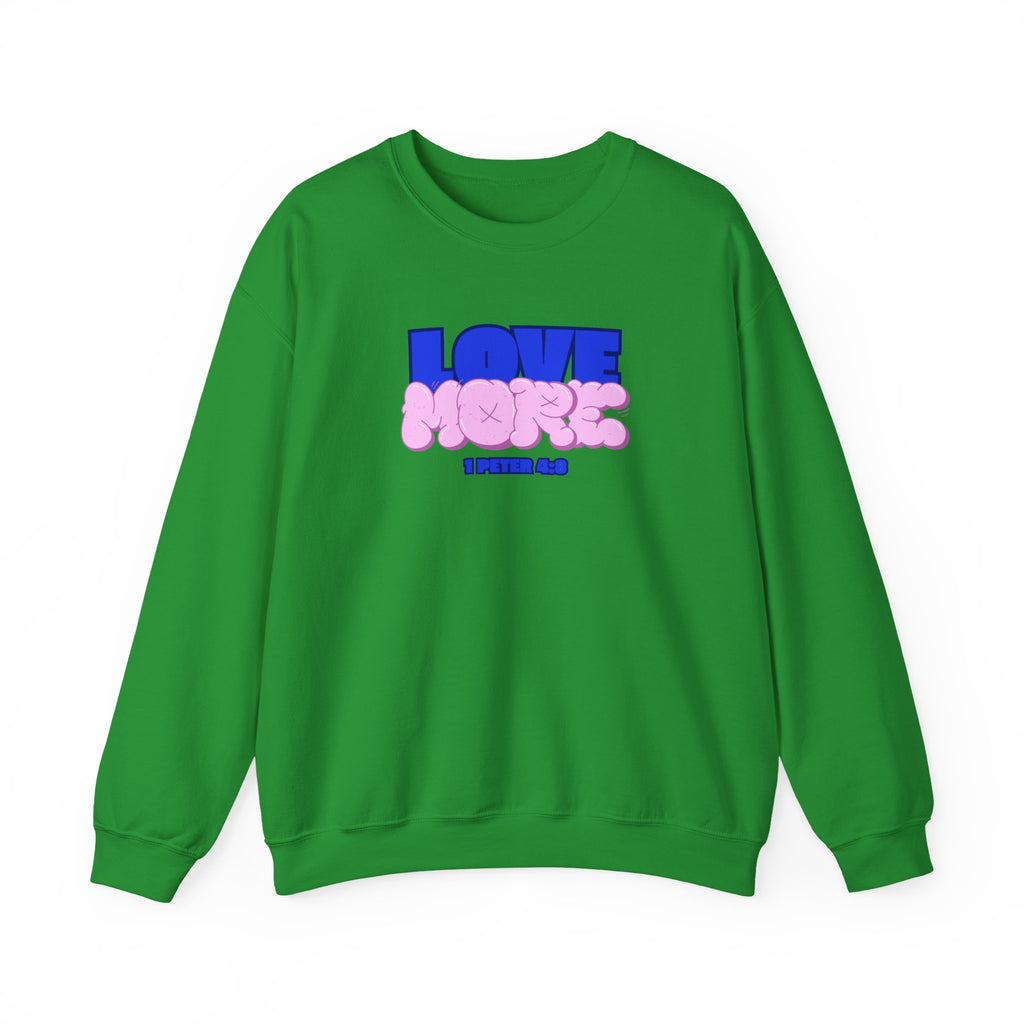 Love More sweater in Irish green, crewneck with blue LOVE graphic and pink plush-style shapes