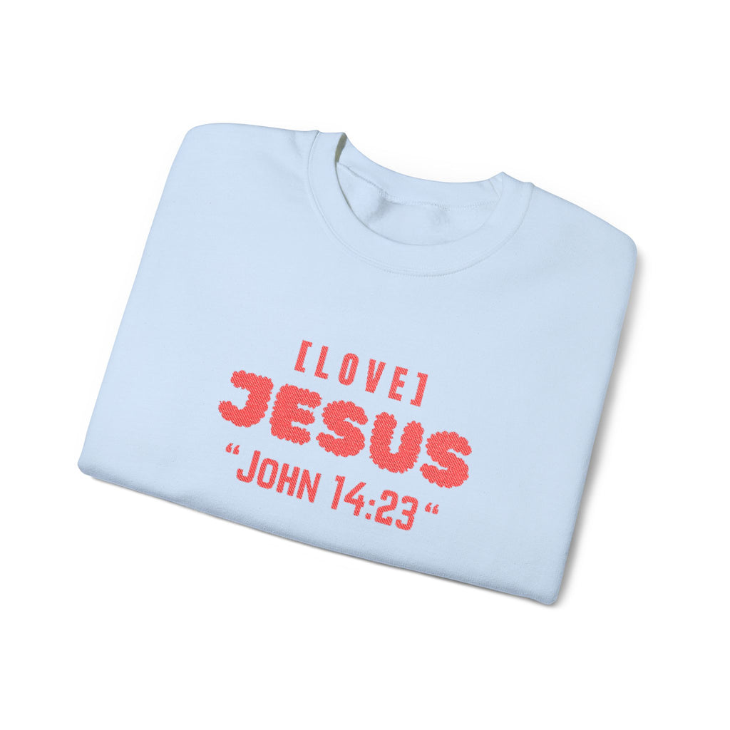 Light blue crewneck sweater with red 'I LOVE JESUS' and 'JOHN 14:23' print.